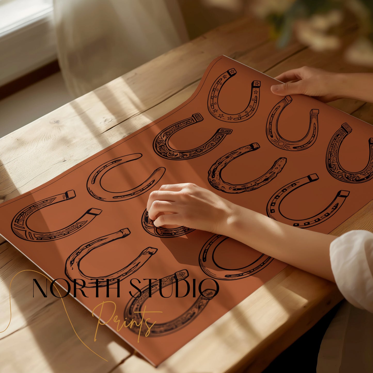 Sheet of paper with various horseshoe drawings in different styles.
