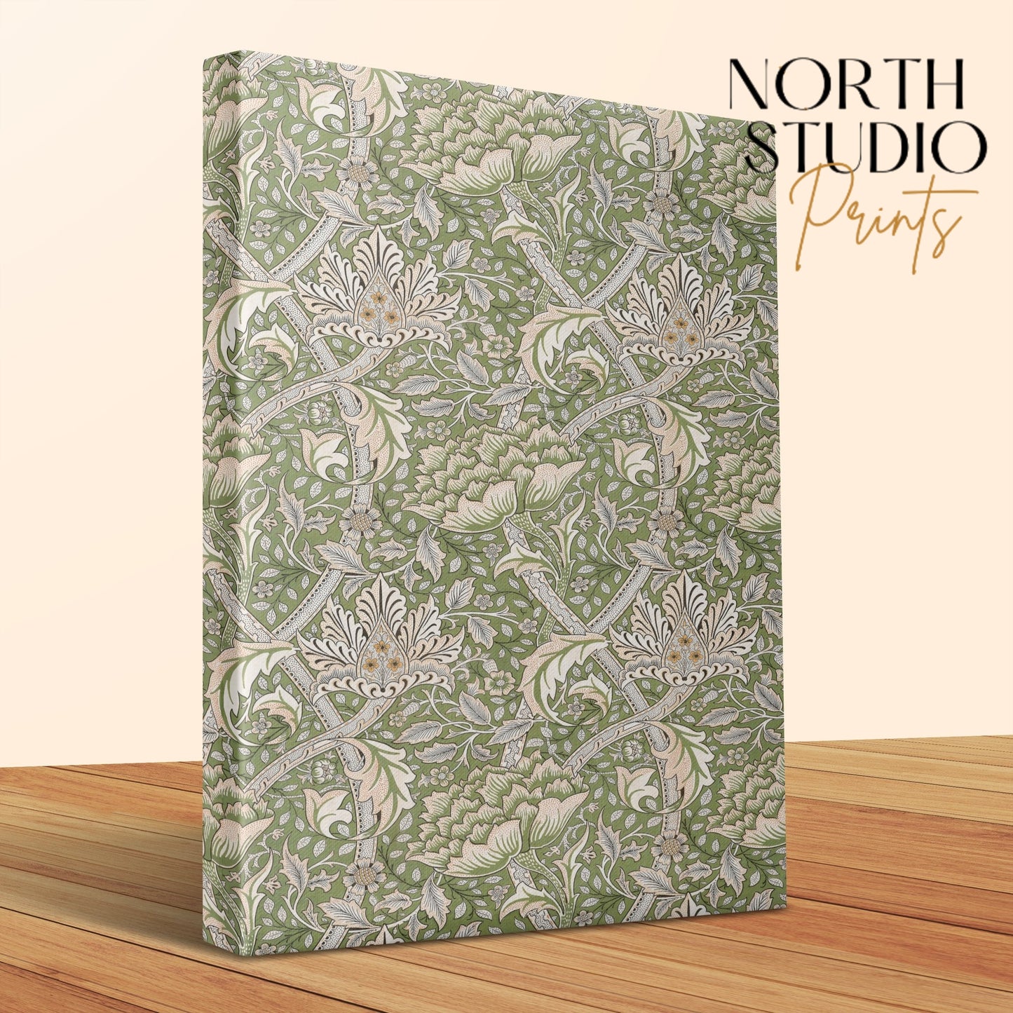 Elegant William Morris style floral canvas wrap with green and beige botanical patterns, displayed on a wooden surface with North Studio Prints branding.