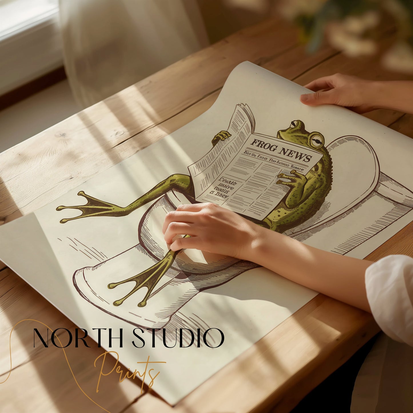 Unframed frog reading newspaper on toilet poster being unrolled on a wooden table, showcasing its premium quality and humorous design.