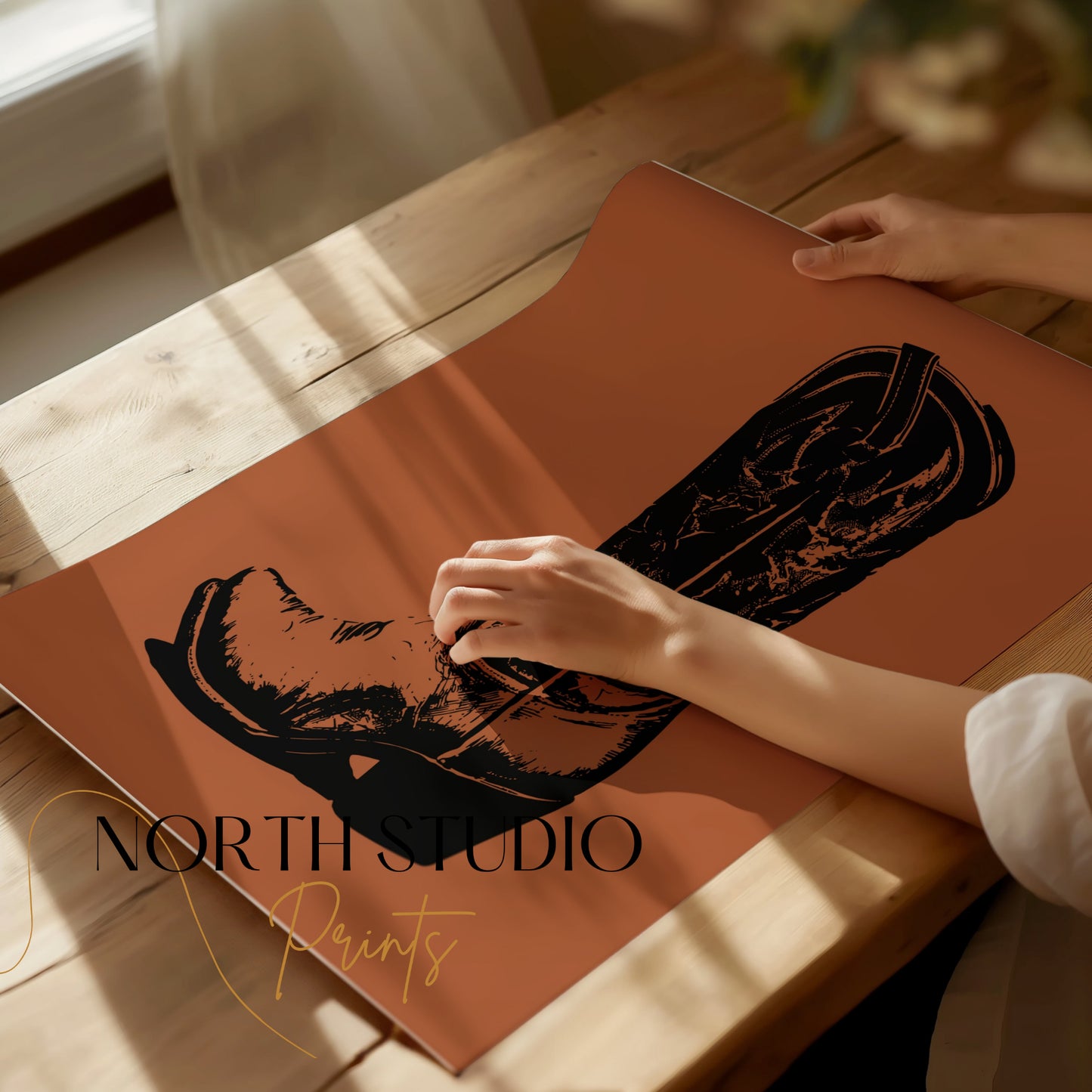 Close-up of a black cowboy boot illustration on a burnt orange paper.