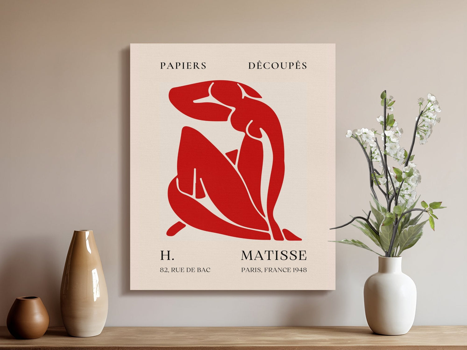 A red and white poster featuring a woman seated on a chair, inspired by Matisse canvas wall ar