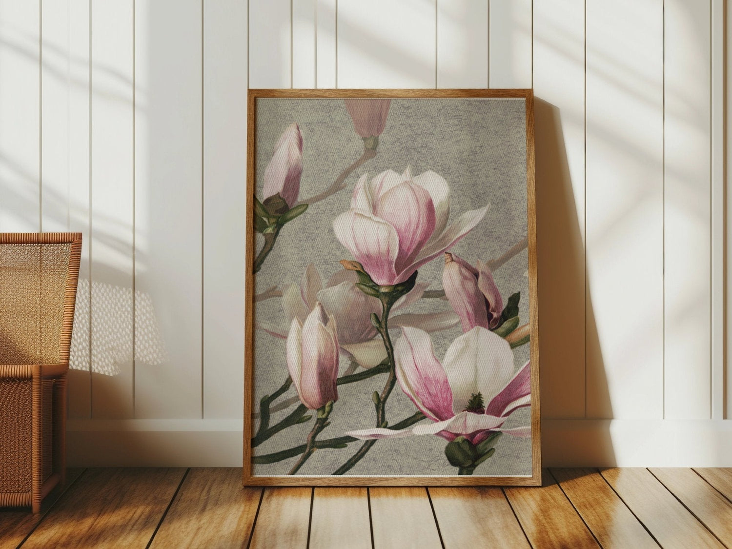 Framed botanical artwork poster of pink magnolia flowers against a textured background.