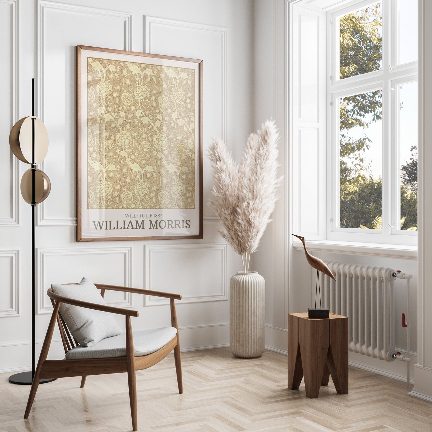 Elegant interior featuring a William Morris 'Wild Tulip 1884' artwork, modern wooden chair, pampas grass in a vase, and natural light from a large window.