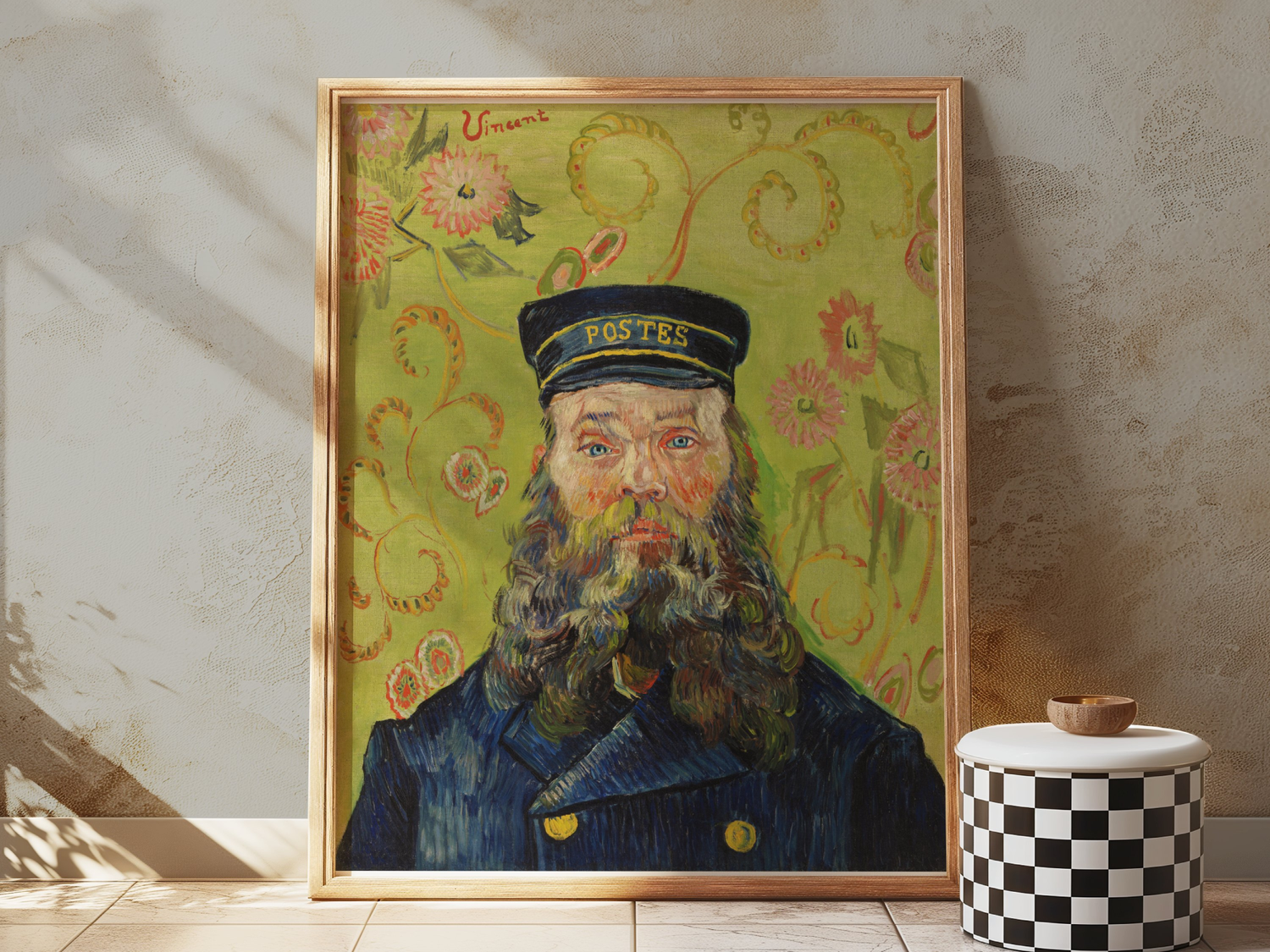 Framed impressionist portrait by Van Gogh of a bearded postman in uniform, set against a vibrant floral background.