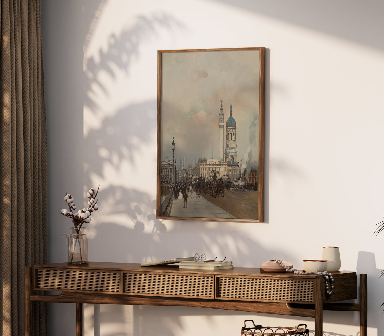 Elegant cityscape poster in a wooden frame, displayed on a stylish console table with decor accents.