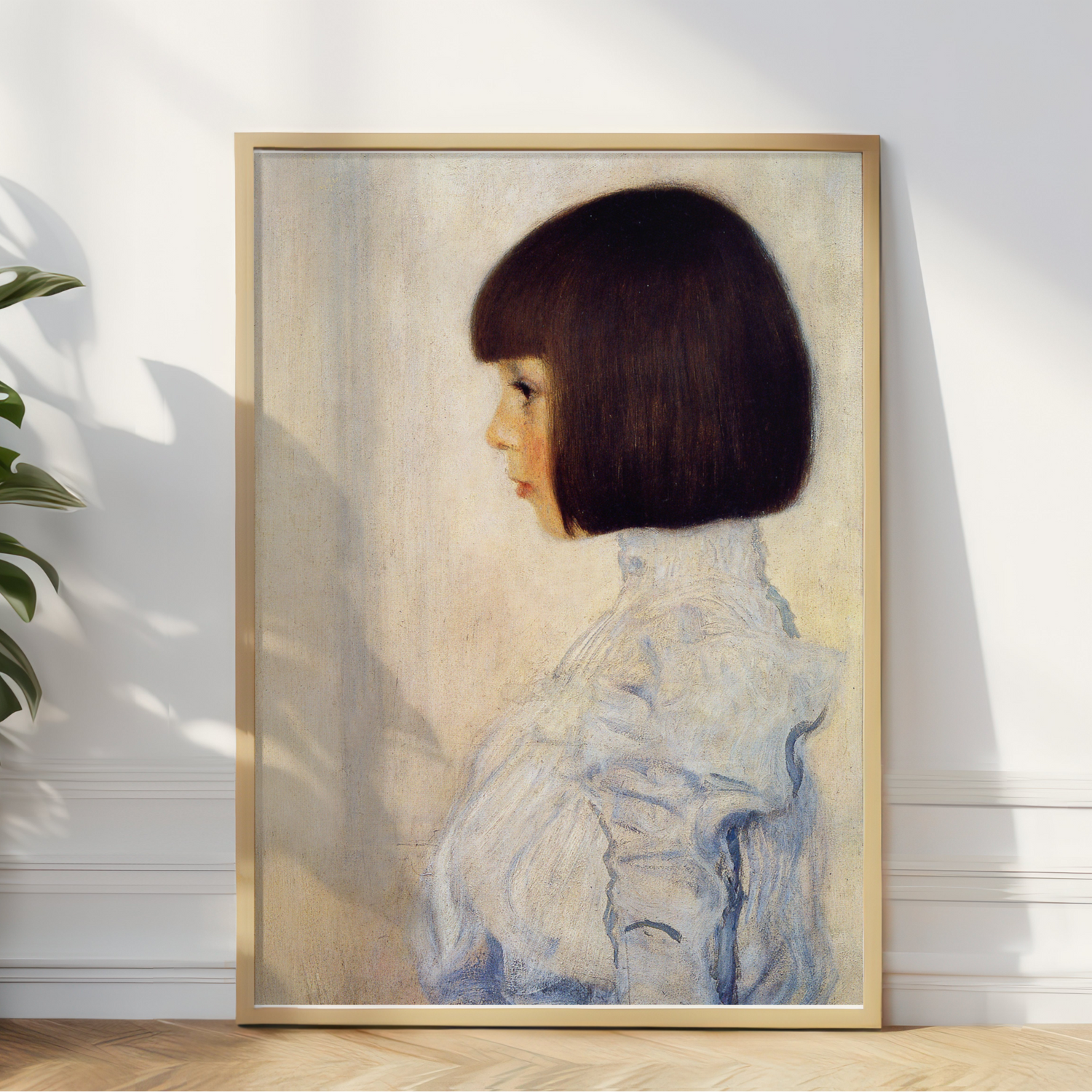 Elegant portrait poster of a woman in profile with a bob haircut, framed and displayed in a well-lit room.