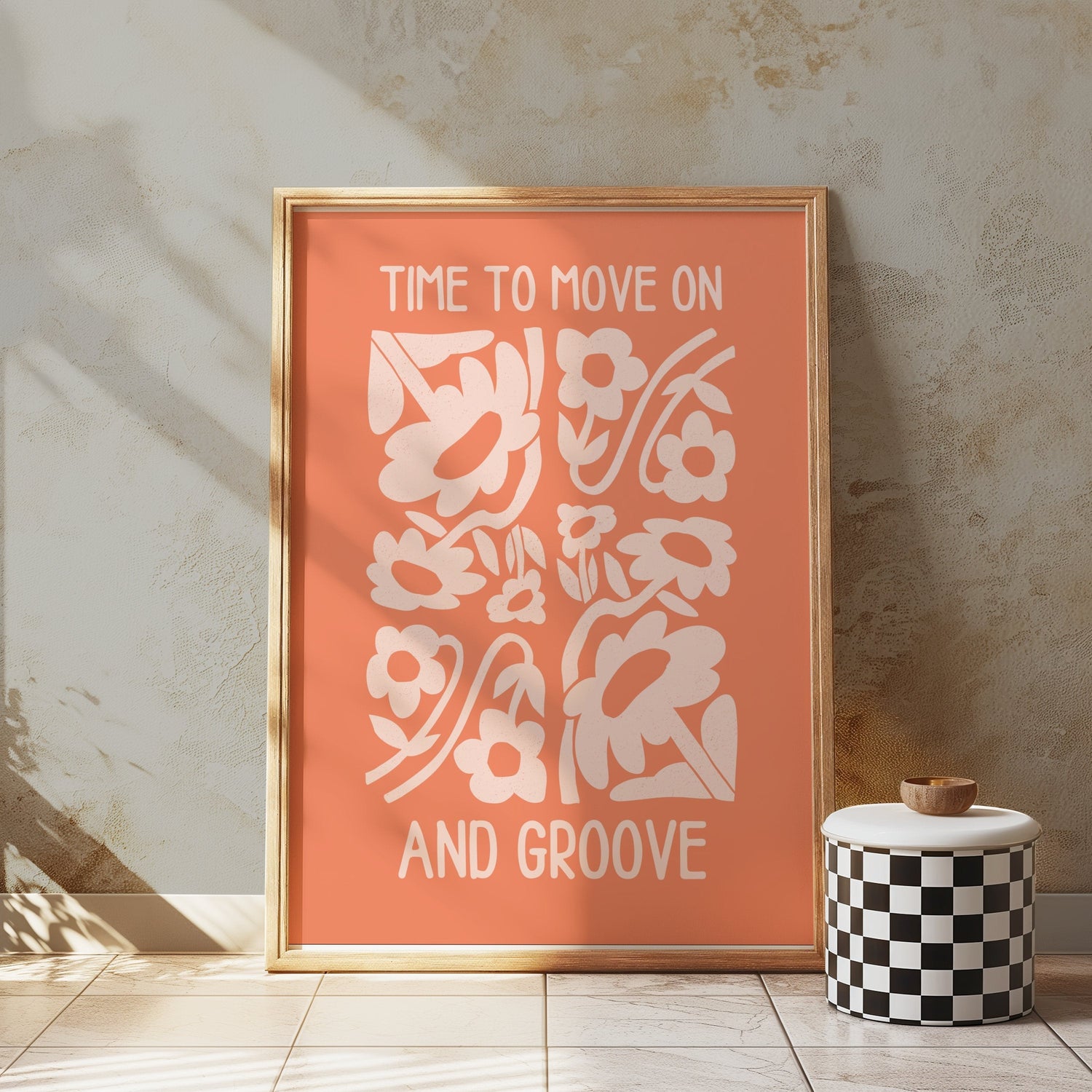 Motivational art poster with floral design and text 'Time to move on and groove' in a wooden frame.