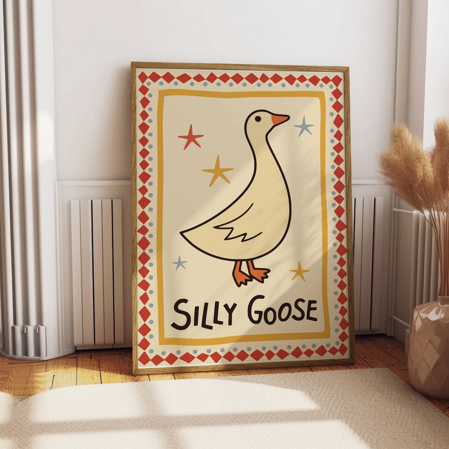 Framed "Silly Goose" art with cartoon goose and stars.
