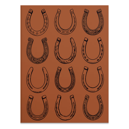 Twelve ornate horseshoes arranged in a 3x4 grid on a brown background.