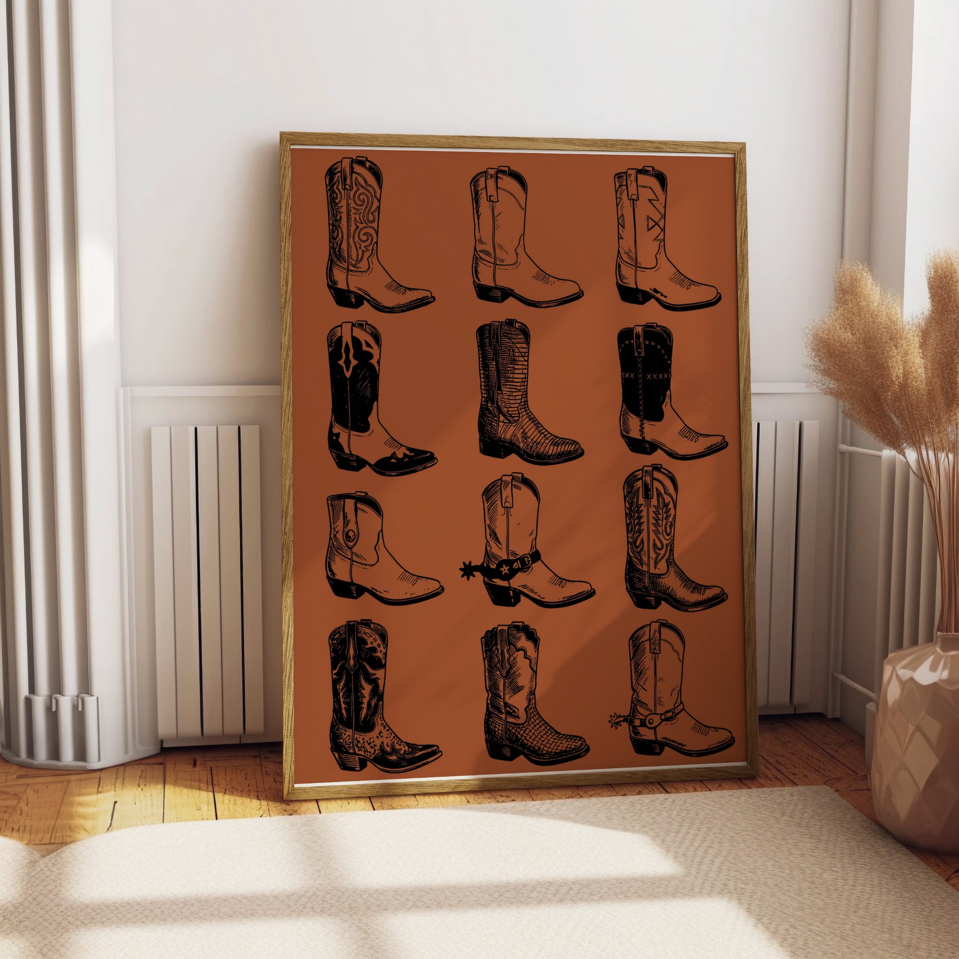 Framed collage of twelve hand-drawn cowboy boots on a brown background.