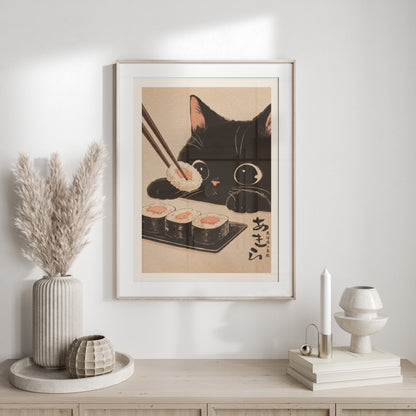 Black cat reaching for sushi with chopsticks, framed artwork with Japanese text.