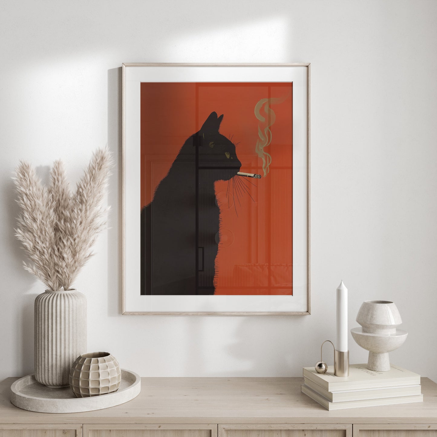 Framed art of a black cat silhouette smoking with orange background and smoke.
