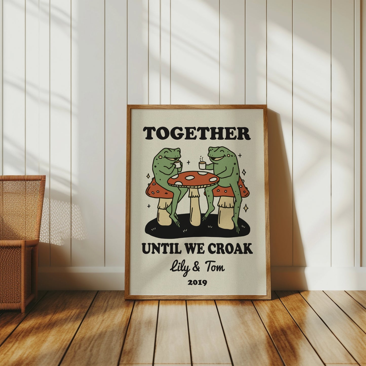 Frogs drinking coffee at a mushroom table with text "Together Until We Croak"