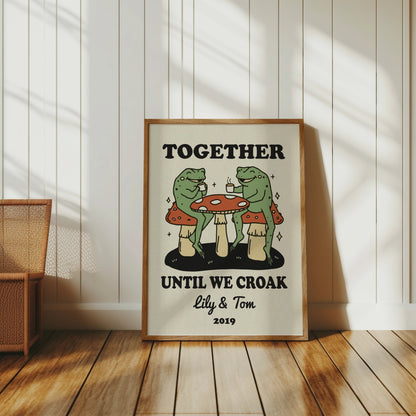Frogs drinking coffee at a mushroom table with text "Together Until We Croak"