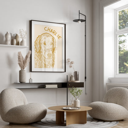 Framed portrait of a golden retriever named Charlie on a cream background.