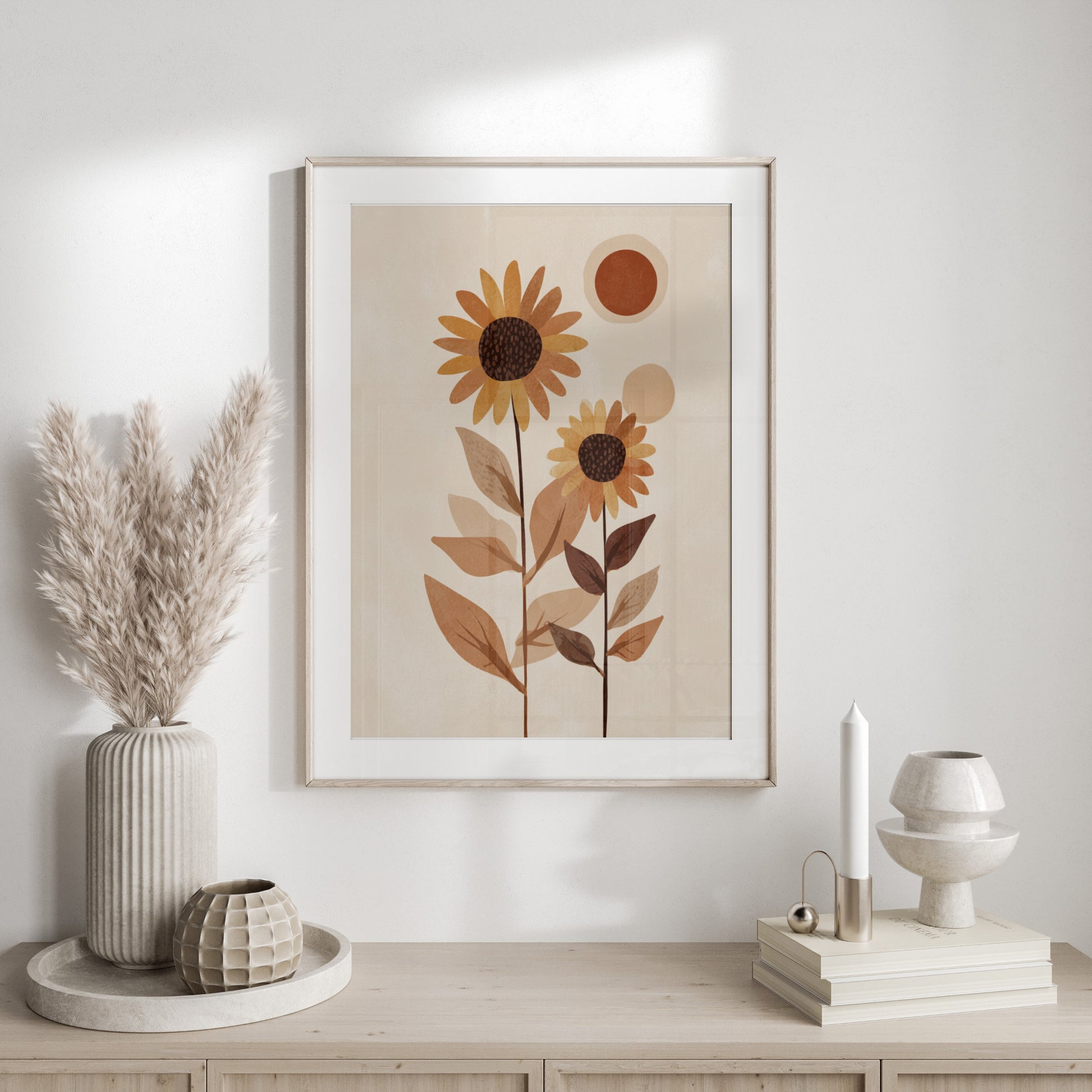Abstract sunflowers in a framed art print with pampas grass and candles.