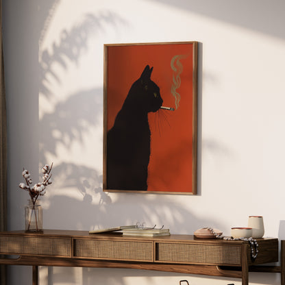 Black cat artwork on orange background, framed, hanging above a wooden console table.