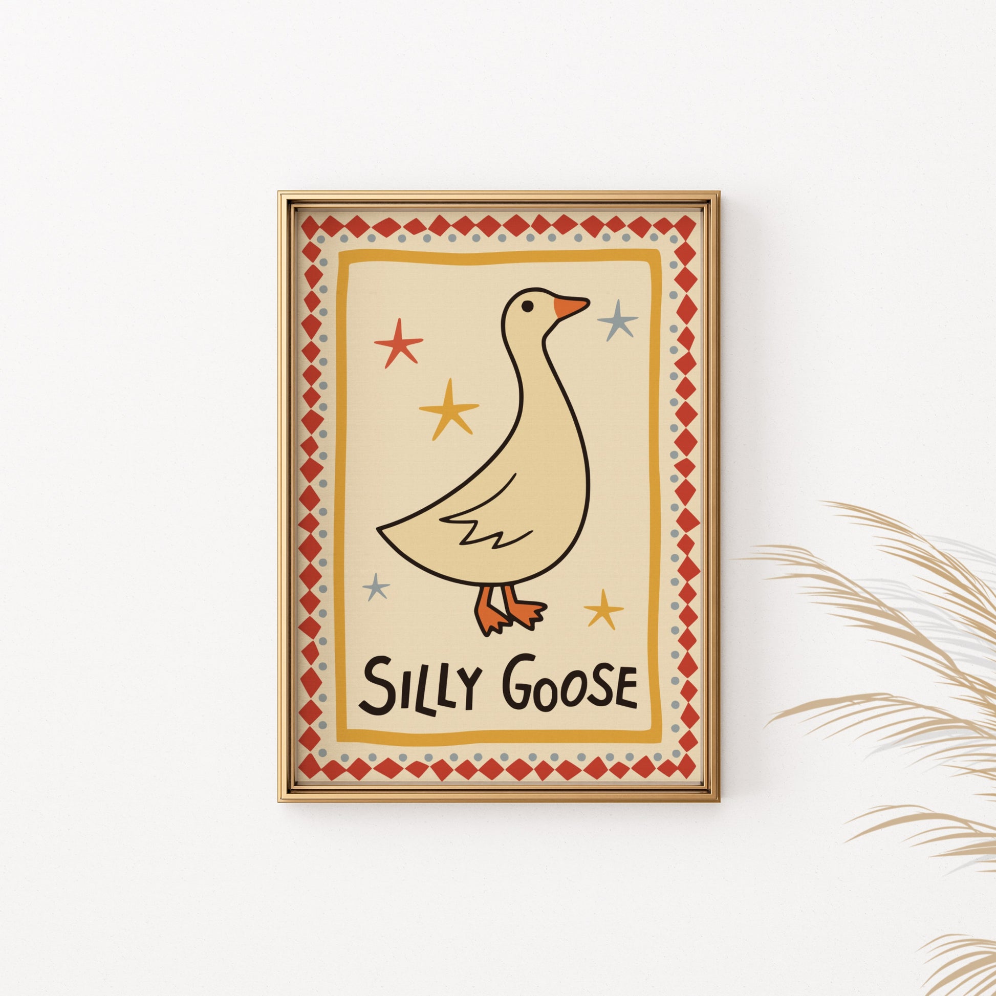 Framed artwork with a cream background featuring a goose illustration and the text "Silly Goose".