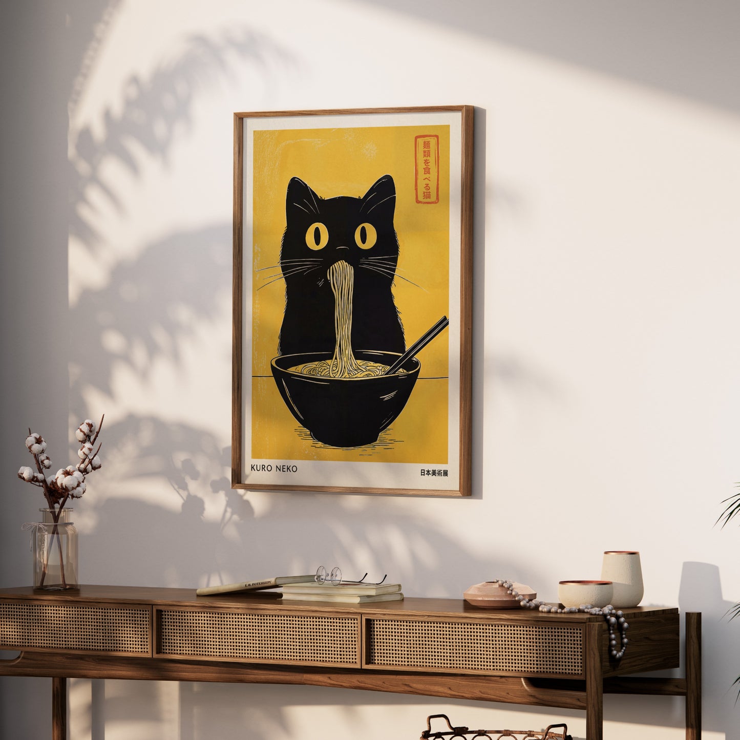 Japanese woodblock print of a black cat eating ramen, framed.