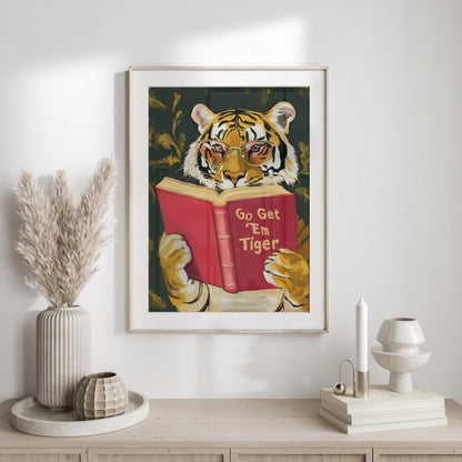 Tiger wearing glasses reads a book titled "Go Get 'Em Tiger."