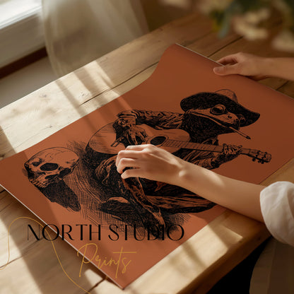 Frog in cowboy hat plays guitar next to skull, North Studio Paints logo.