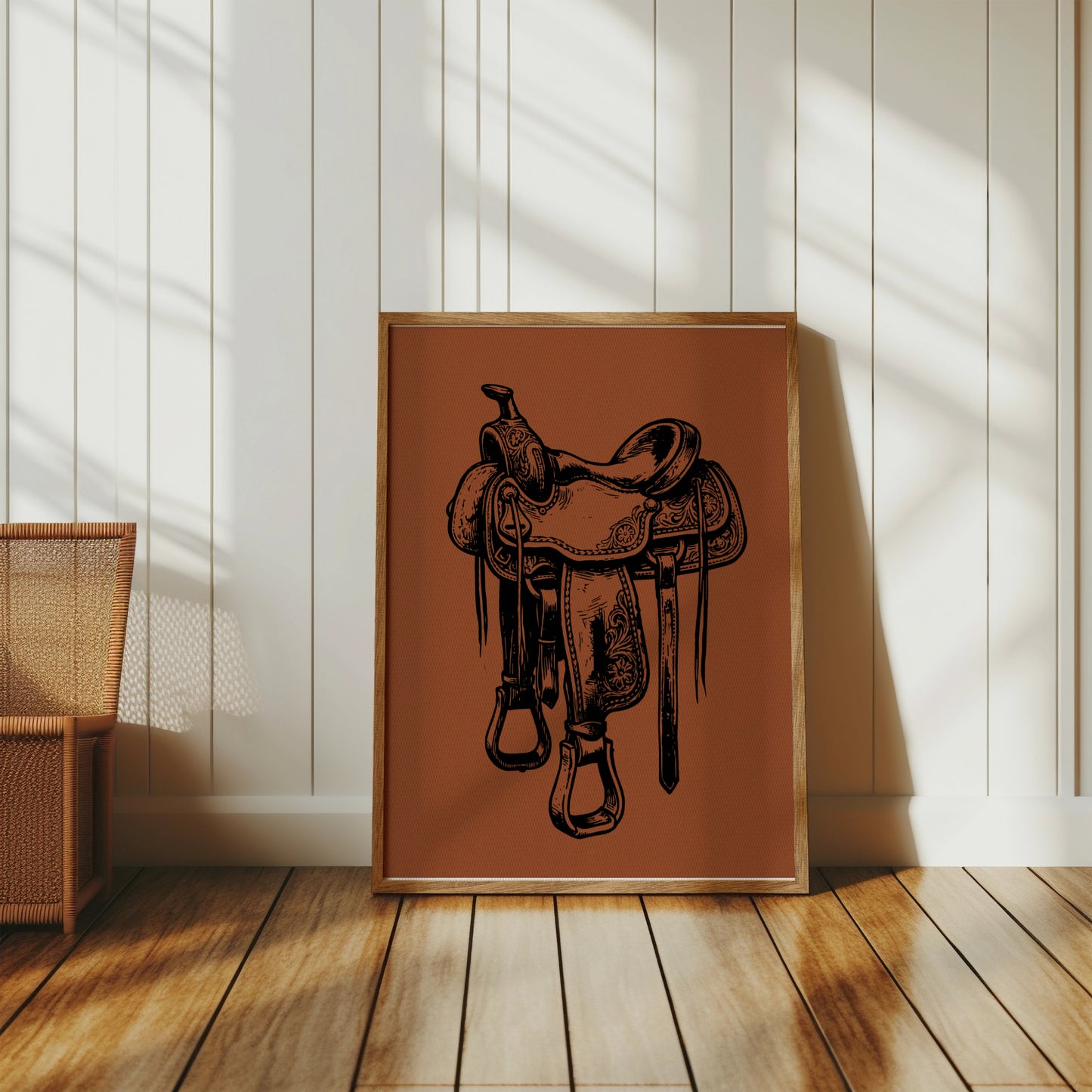 Framed illustration of a vintage western saddle with ornate tooling.