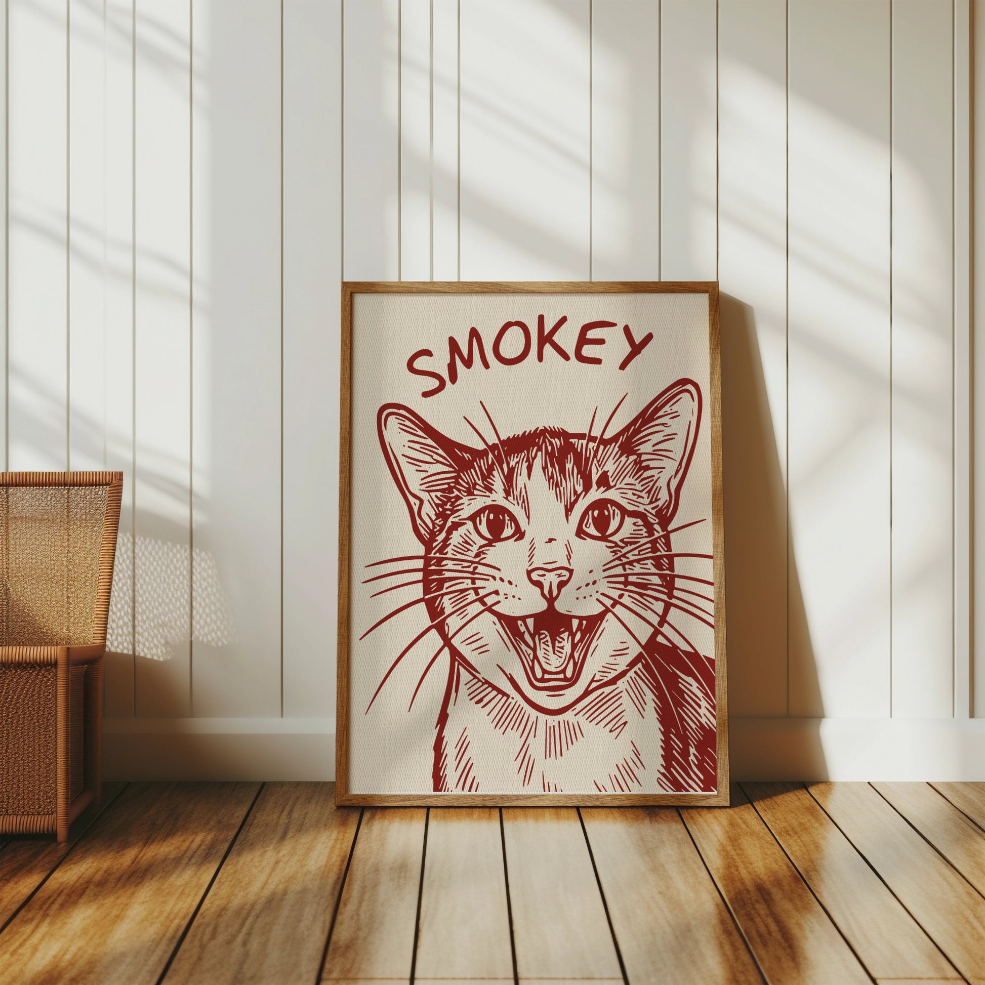 Framed sketch of a happy cat's face with "SMOKEY" text above.