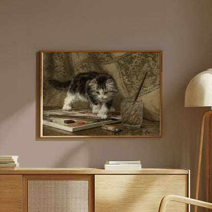 Premium Poster of Adorable Kitten Standing On Art Supplies Posters