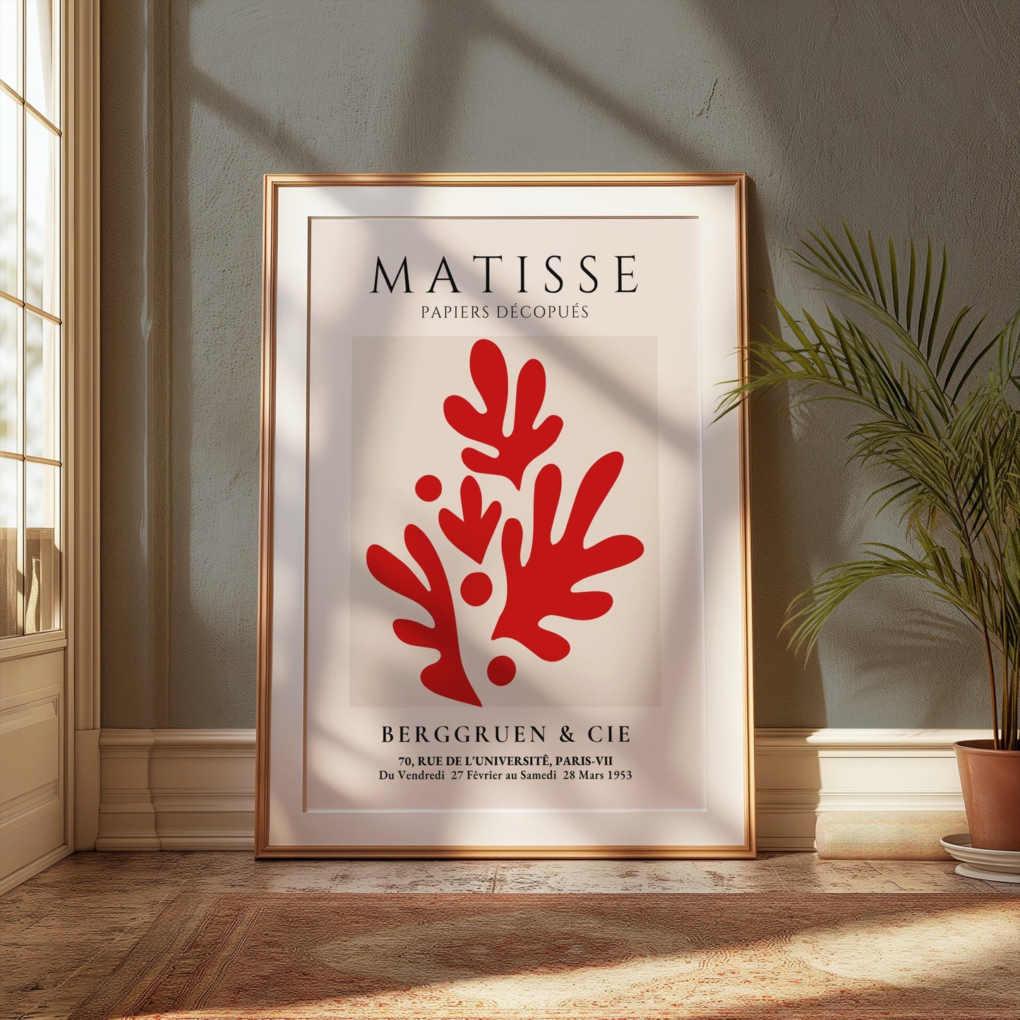 Framed Matisse Papiers Découpés poster with red abstract cutouts, styled in a sunlit room with plants and warm-toned decor for a vintage aesthetic.