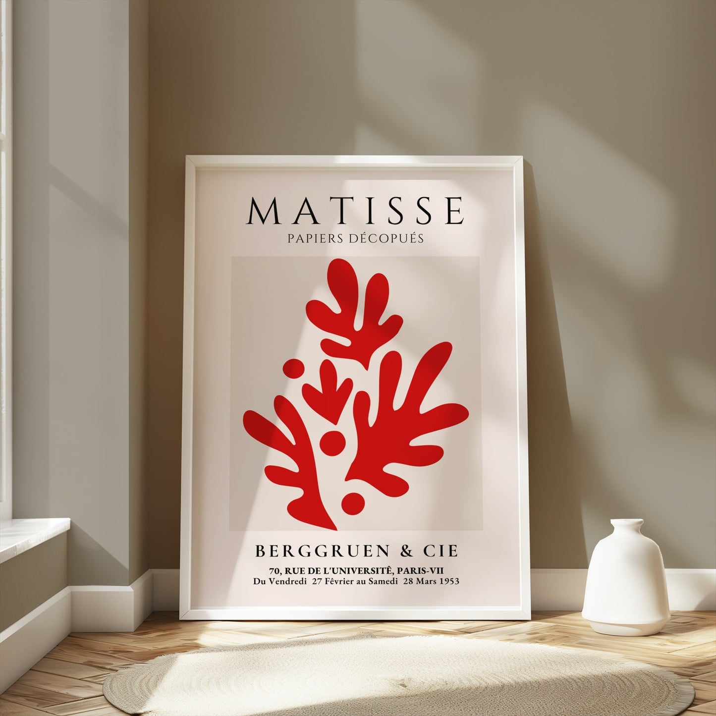 Framed Matisse Papiers Découpés poster featuring red abstract cutouts, displayed in a modern room with neutral tones and soft natural lighting.