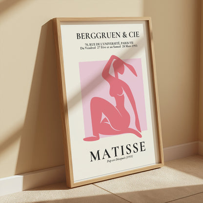 Framed BERGGRUEN & CIE Matisse exhibition vintage poster with a pink silhouette cut-out, leaning against a beige wall in soft lighting.