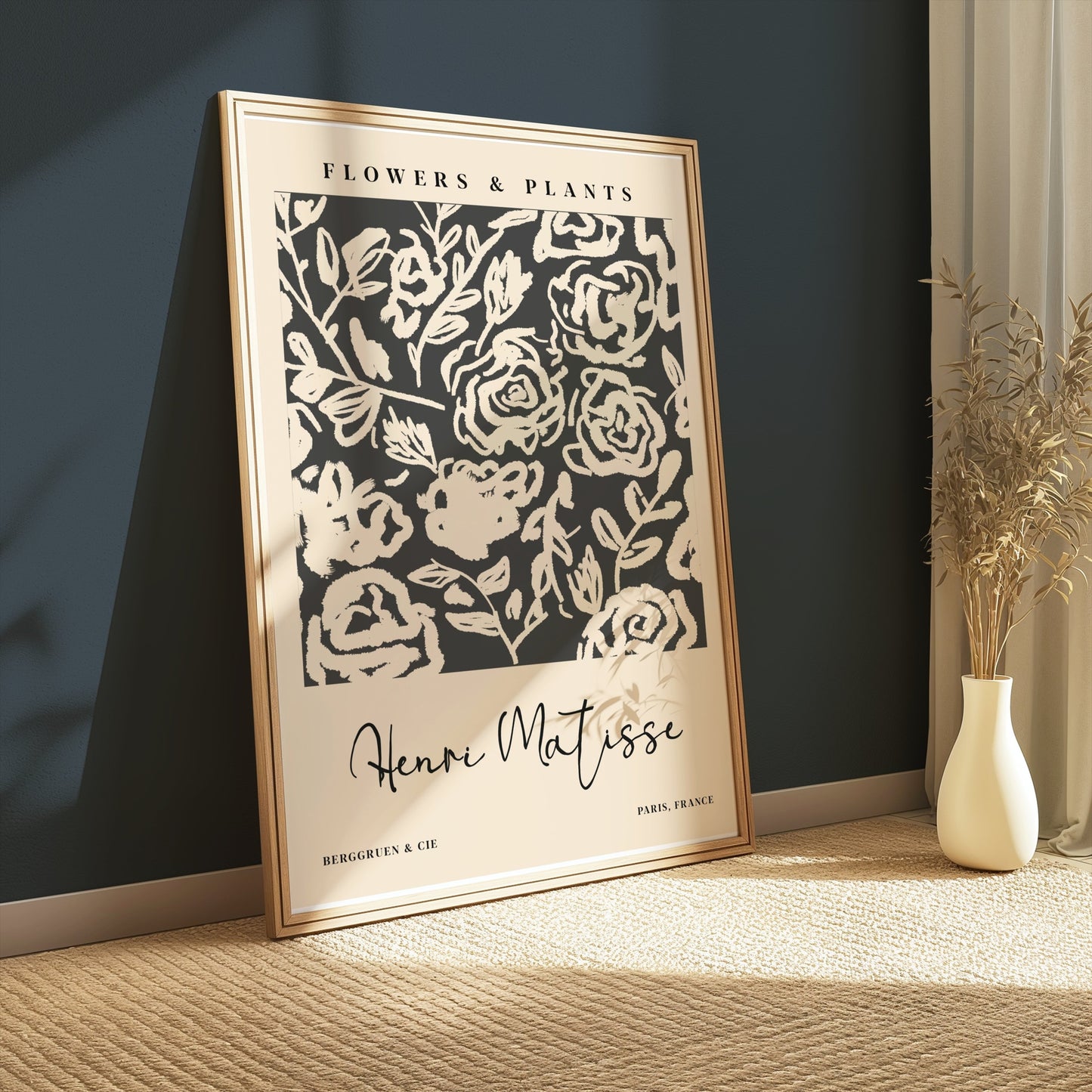 Framed Henri Matisse floral art print leaning against a dark green wall, showcasing abstract black and white botanical design for modern interiors.