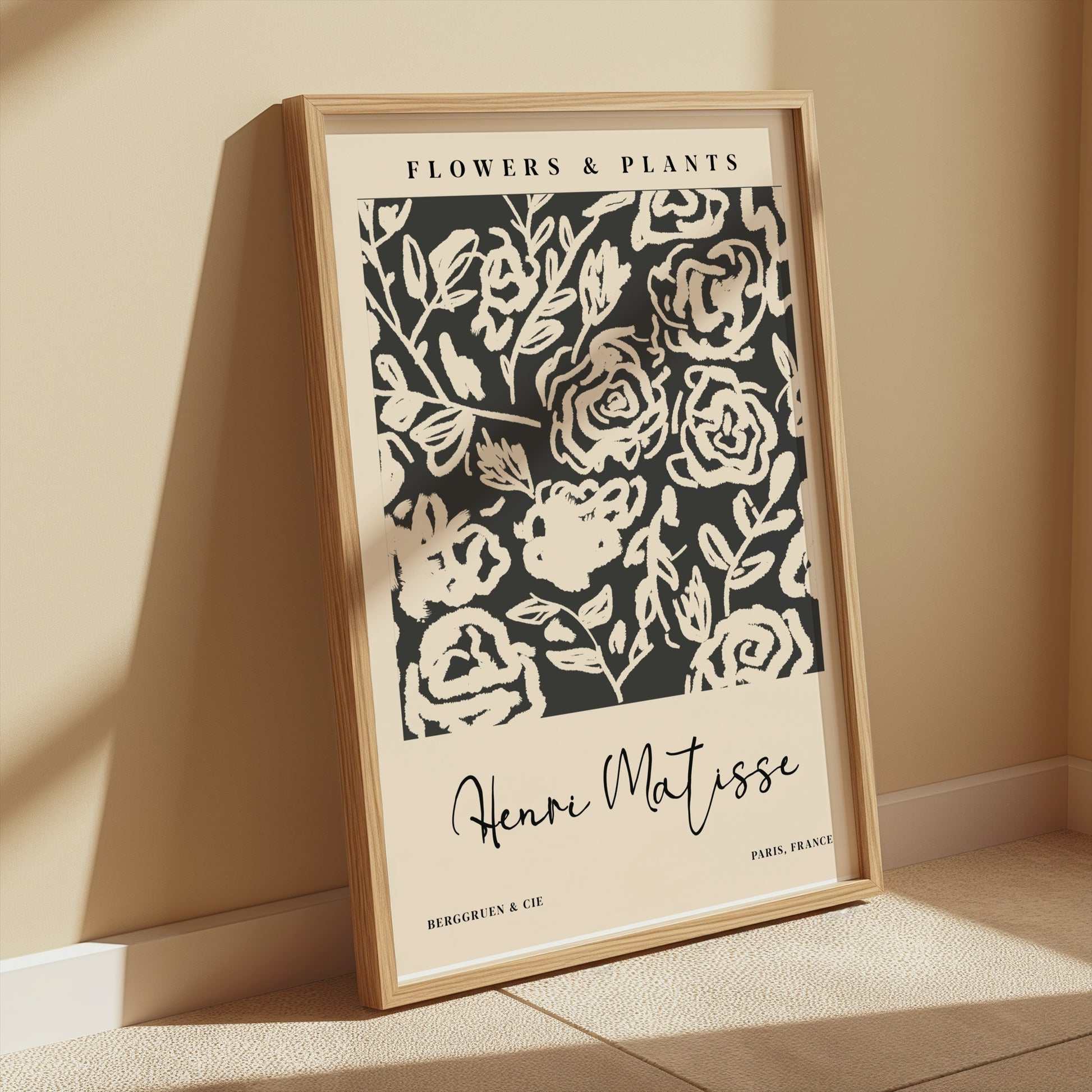 Henri Matisse floral art print in a wooden frame, leaning against a beige wall with soft shadows, ideal for minimalist interiors.