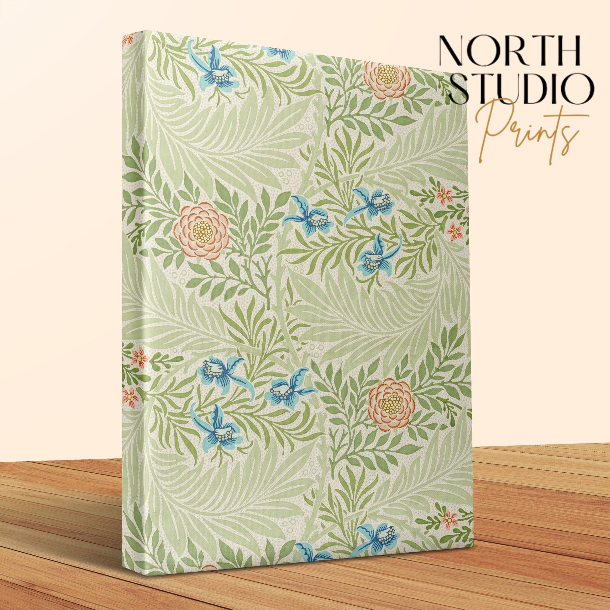 Close-up of William Morris floral canvas wrap with intricate botanical patterns, displayed on a wooden surface with North Studio Prints branding.