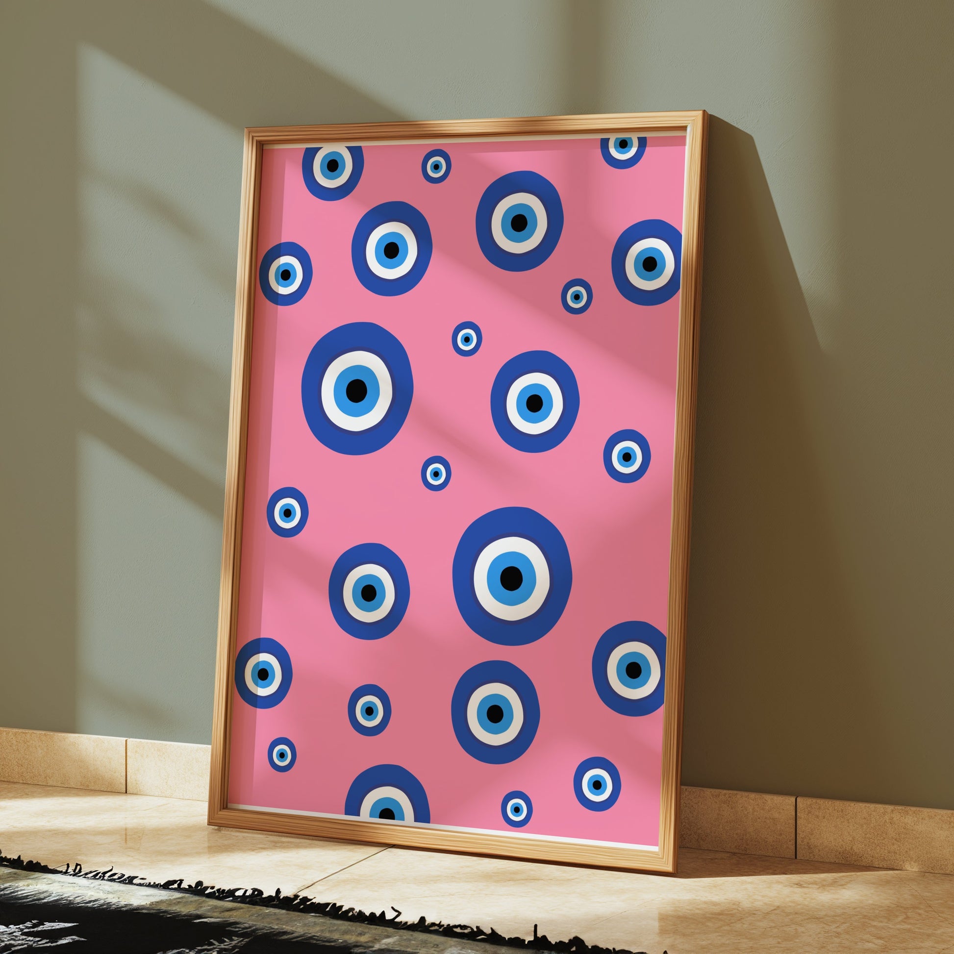 Premium Poster of Colorful Blue Eye Pattern on Pink Background Posters