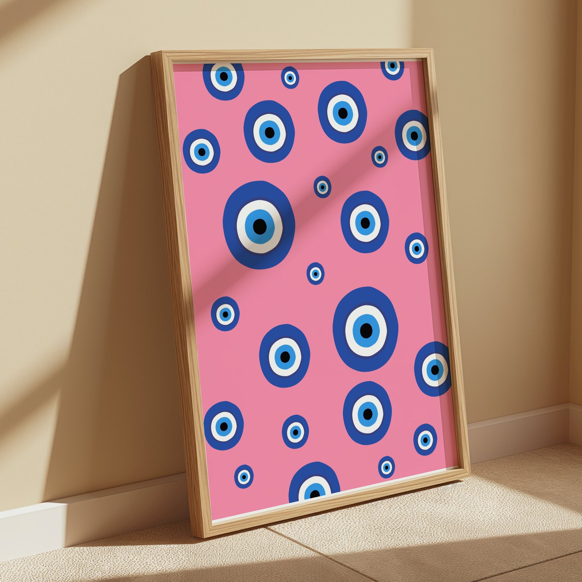 Premium Poster of Colorful Blue Eye Pattern on Pink Background Posters