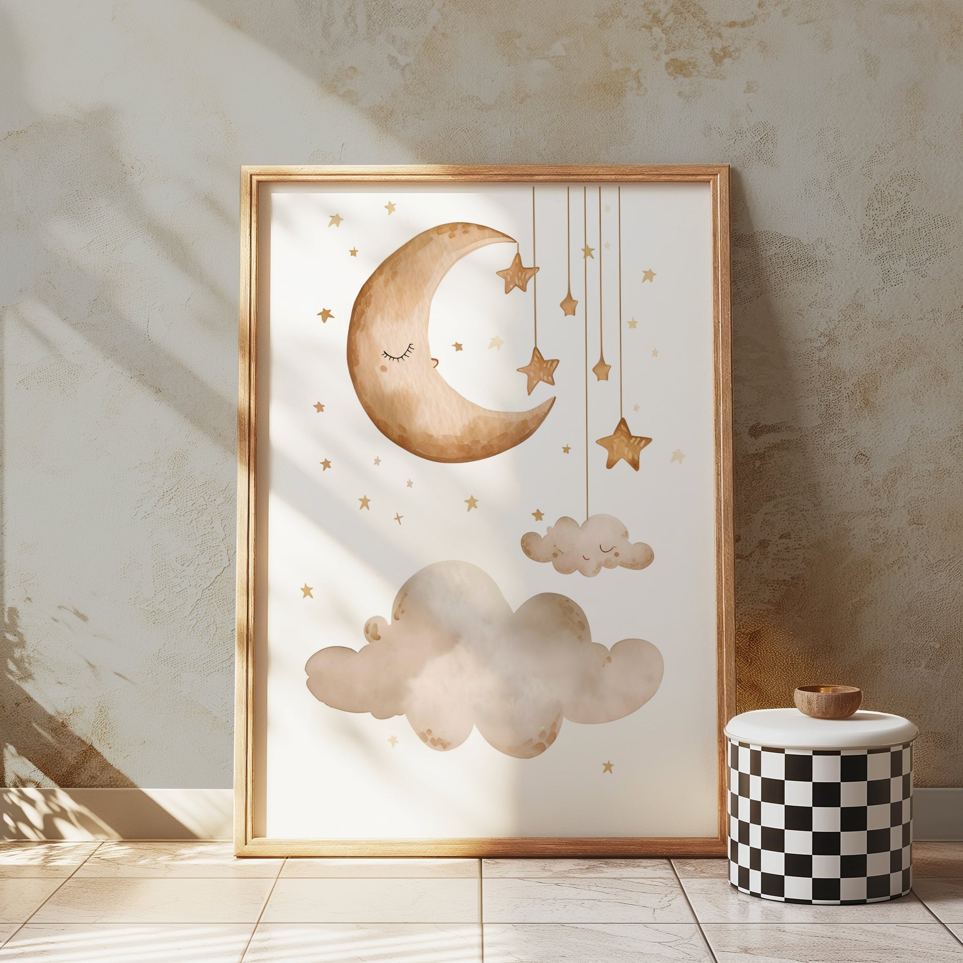 Framed celestial nursery wall art with a crescent moon, stars, and clouds, styled in a cozy, sunlit room with neutral decor.