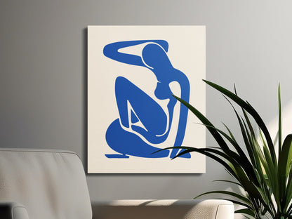 Minimalist Henri Matisse inspired canvas wrap with a blue abstract figure, styled in a modern living space with plants and neutral furniture.