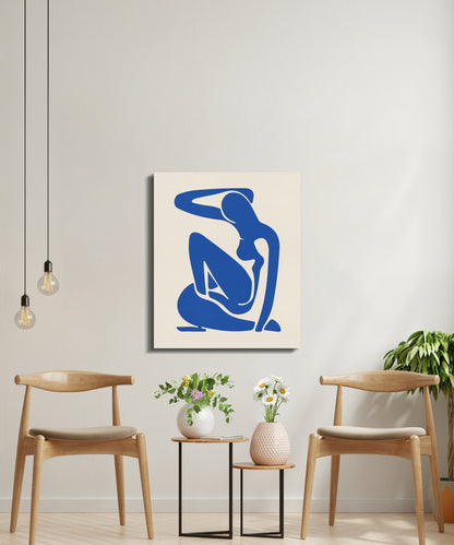 Elegant Henri Matisse inspired canvas wrap displayed in a minimalist seating area with wooden chairs, plants, and pendant lighting.