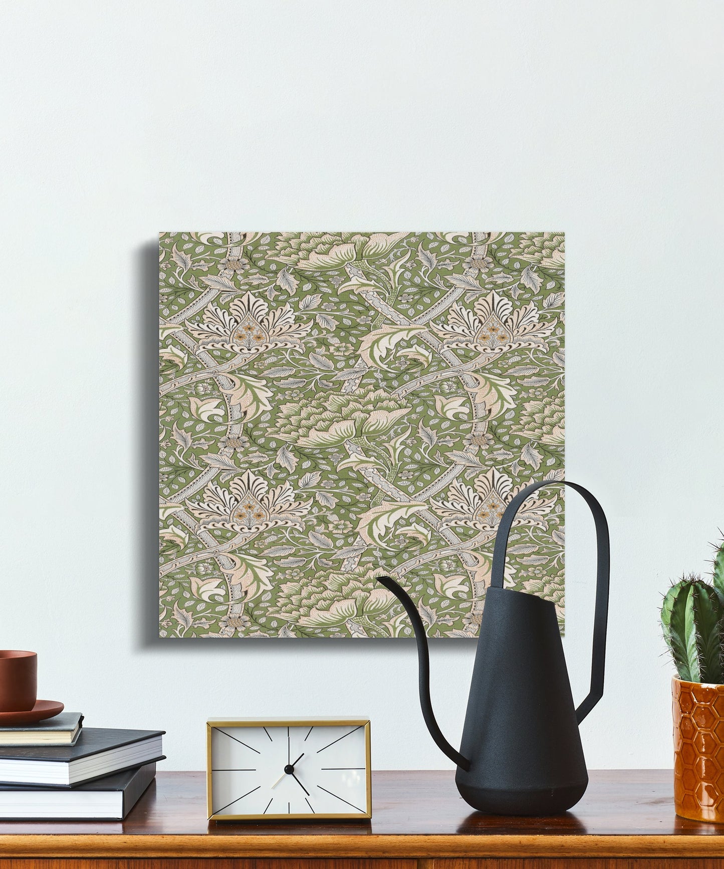 Square William Morris style floral canvas wrap displayed on a wall with modern decor, showcasing green and beige botanical art for home interiors.