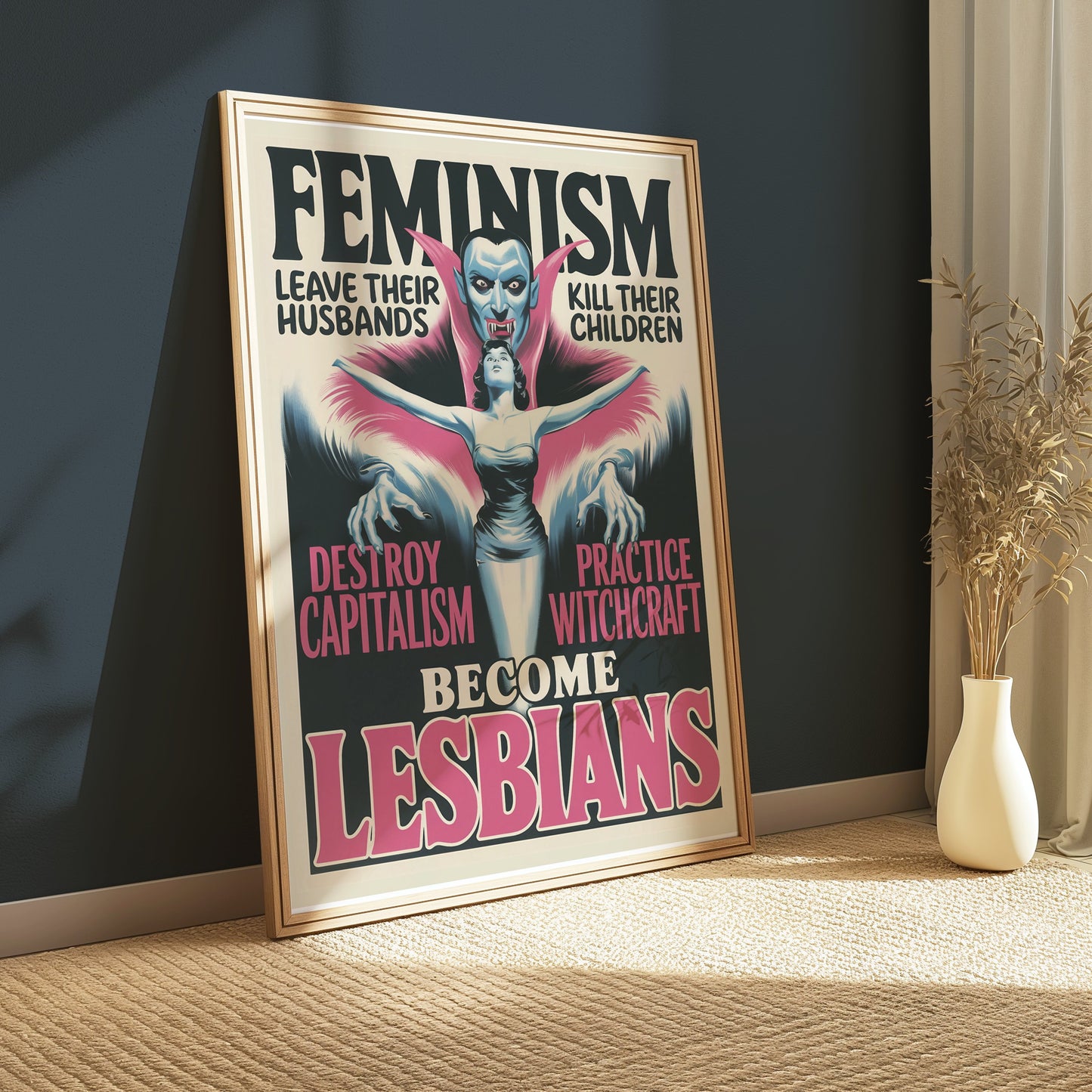 Framed retro feminism art poster with bold feminist text and vampire imagery, displayed in a cozy room with natural light.