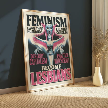 Framed retro feminism art poster with bold feminist text and vampire imagery, displayed in a cozy room with natural light.