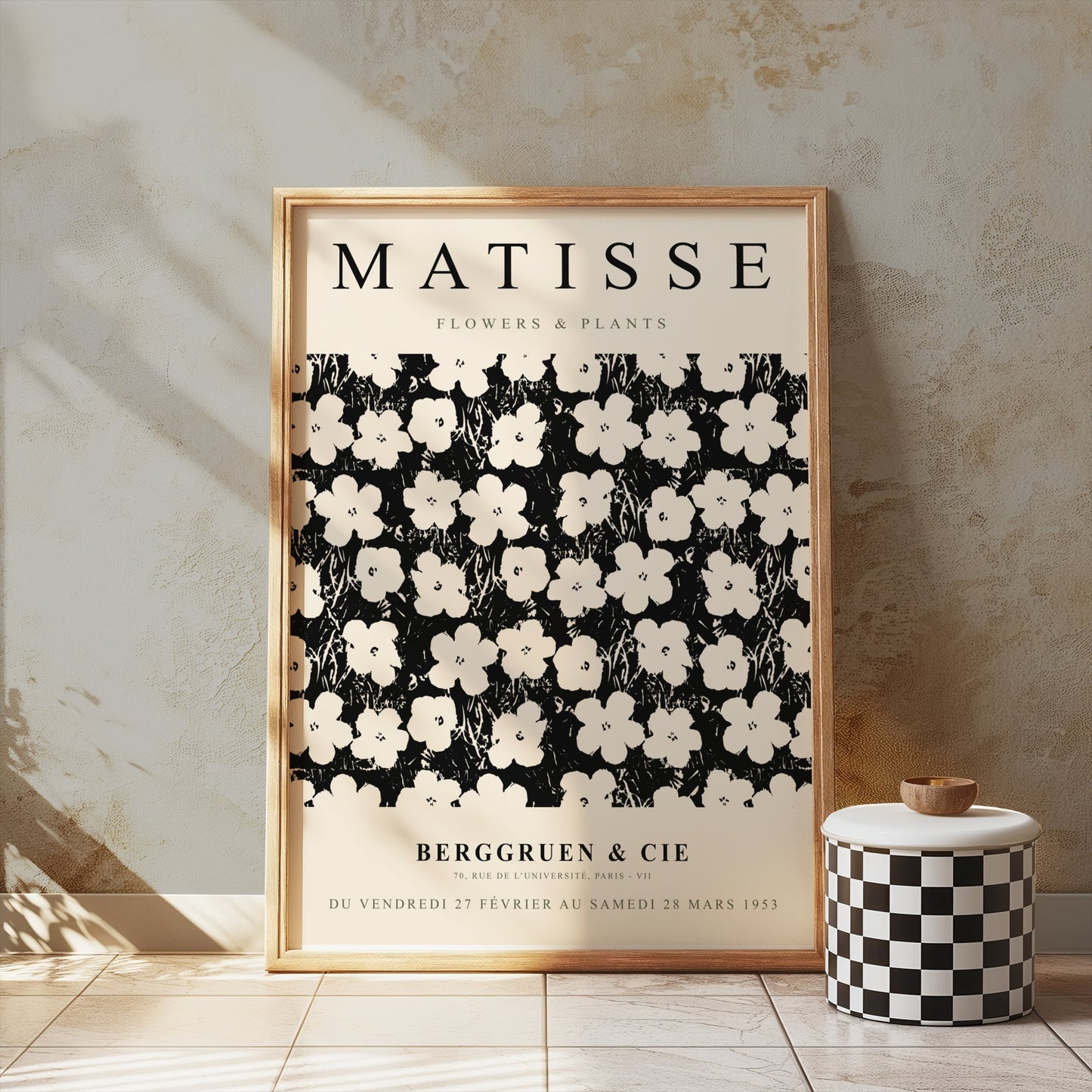 Framed Matisse Flowers & Plants poster leaning against a textured wall, styled with a checkered decorative jar in a minimalist setting.