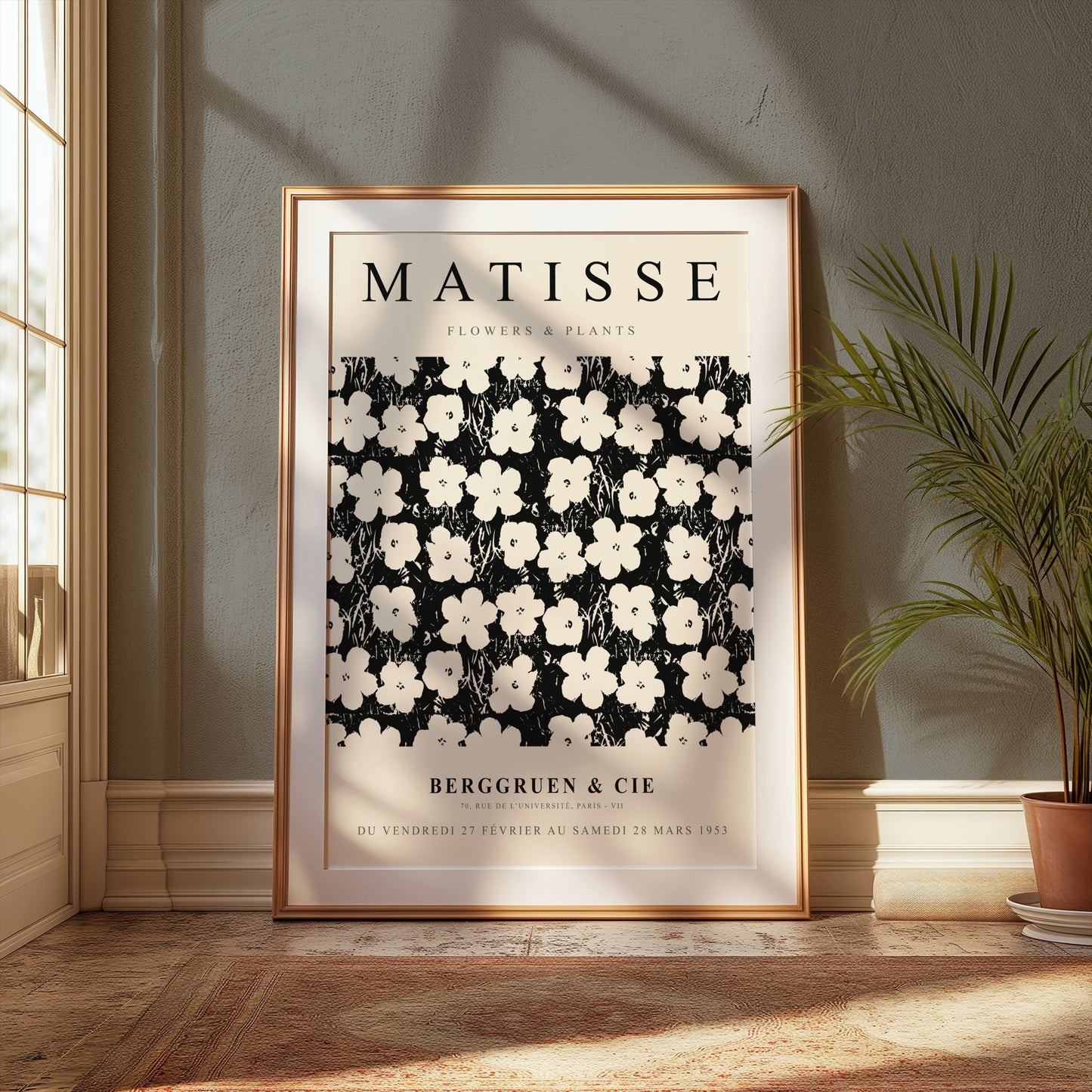 Matisse Flowers & Plants poster in a gold frame placed on a wooden floor near a window with natural light and a potted plant.