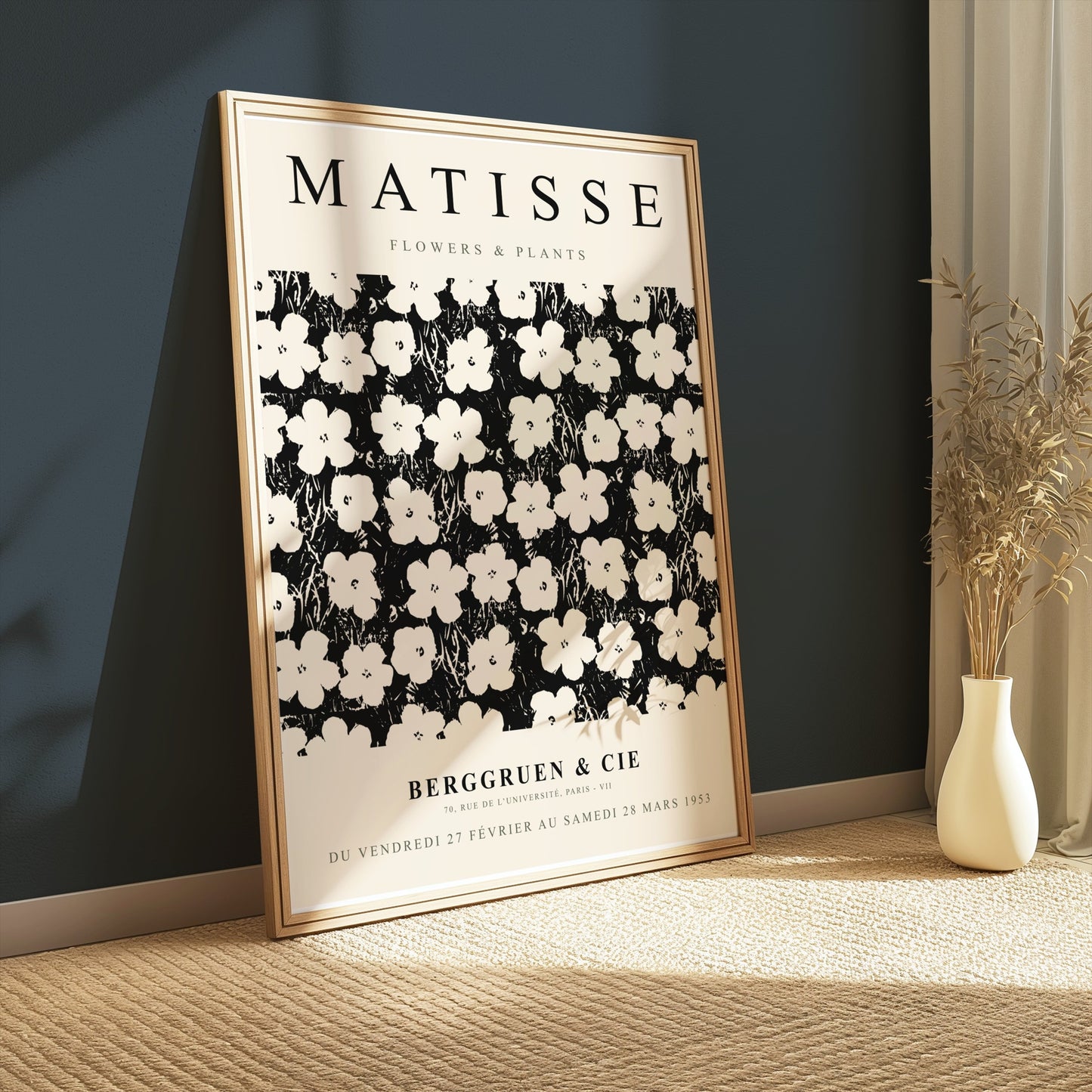 Framed Matisse Flowers & Plants poster leaning against a dark wall, styled with a vase of dried plants on a textured carpet.