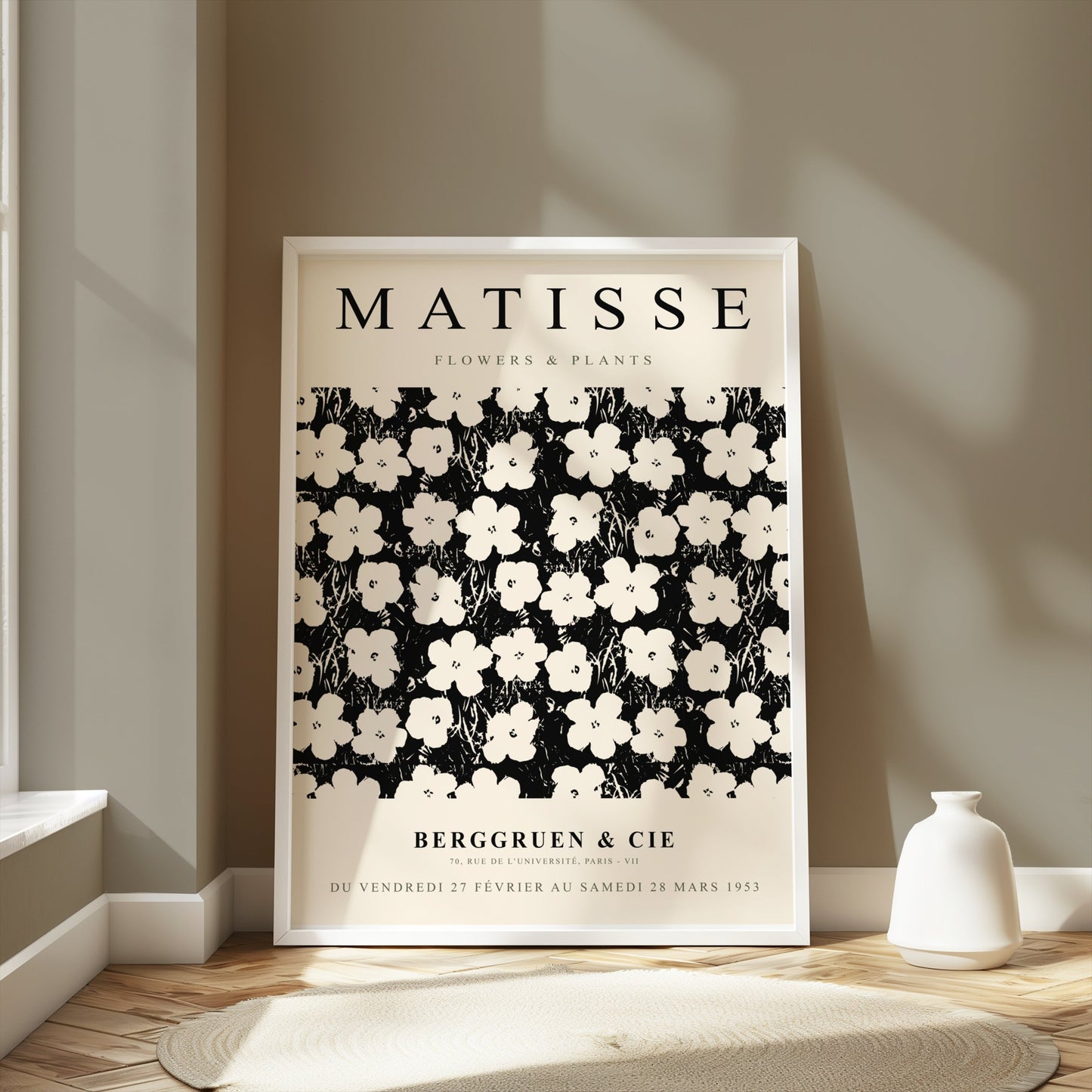 Framed Matisse Flowers & Plants poster displayed in a bright room with neutral decor, styled with a white vase on the floor.