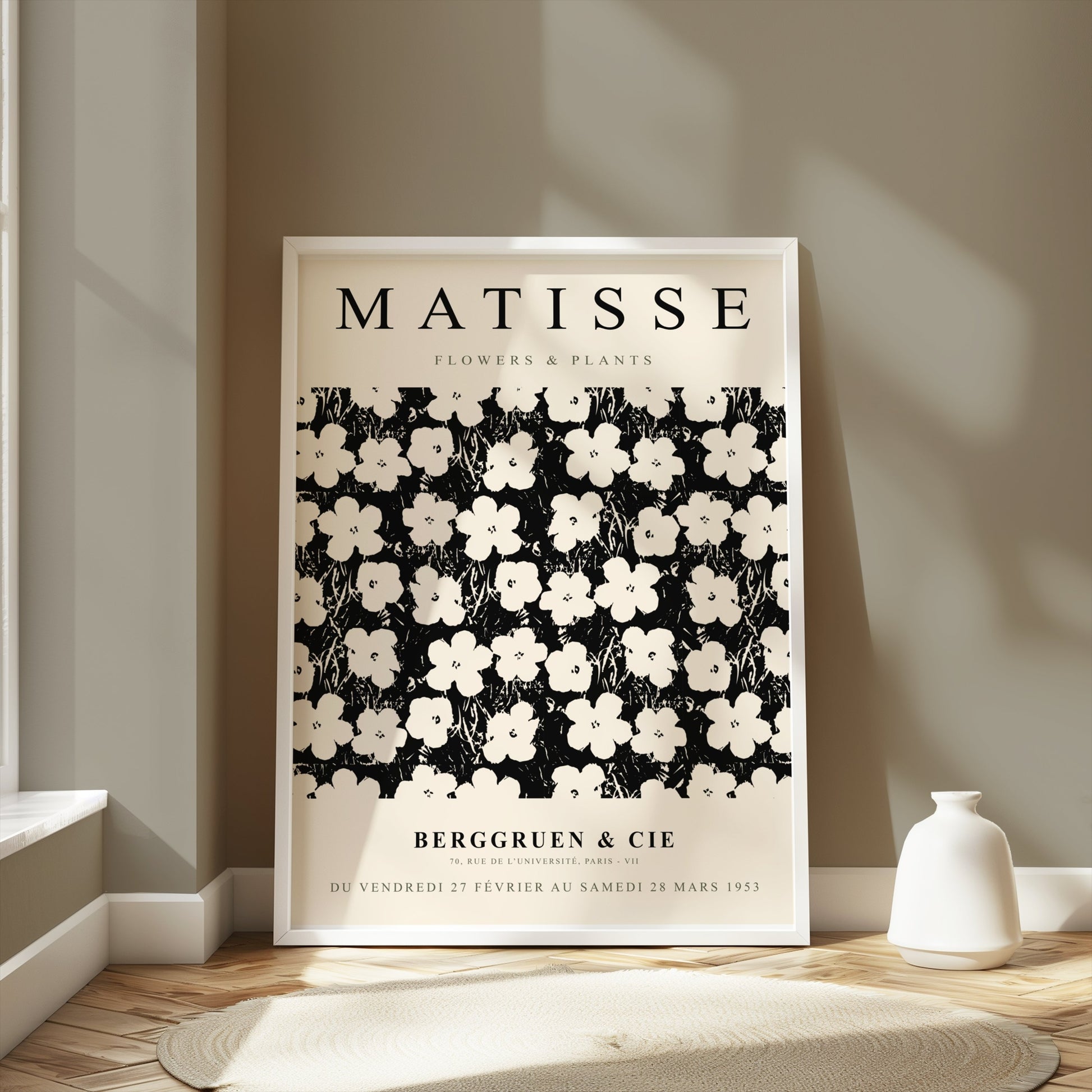 Framed Matisse Flowers & Plants poster displayed in a bright room with neutral decor, styled with a white vase on the floor.