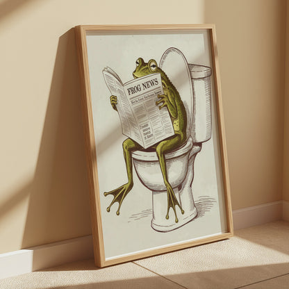 Frog reading newspaper on toilet poster framed and leaning against a beige wall, perfect for adding quirky charm to any space.
