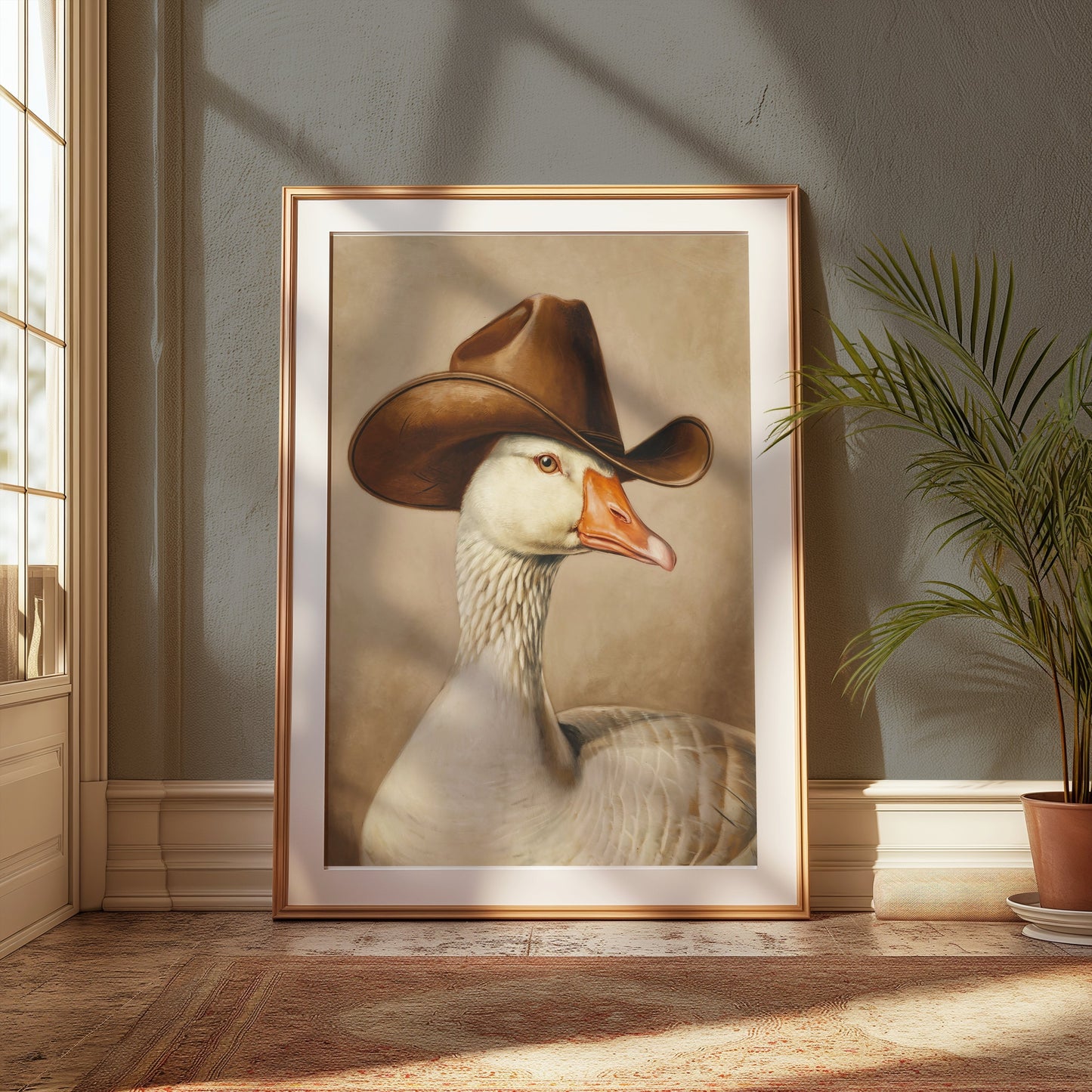 Framed goose wearing cowboy hat art print displayed in a sunlit room, perfect for farmhouse or quirky home decor enthusiasts.