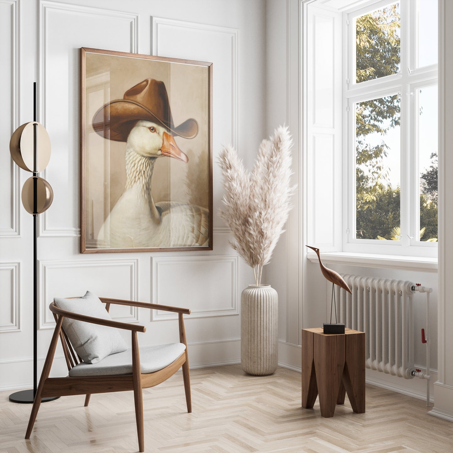 Goose wearing cowboy hat art print elegantly framed and hung in a bright, minimalist living room with natural decor elements.